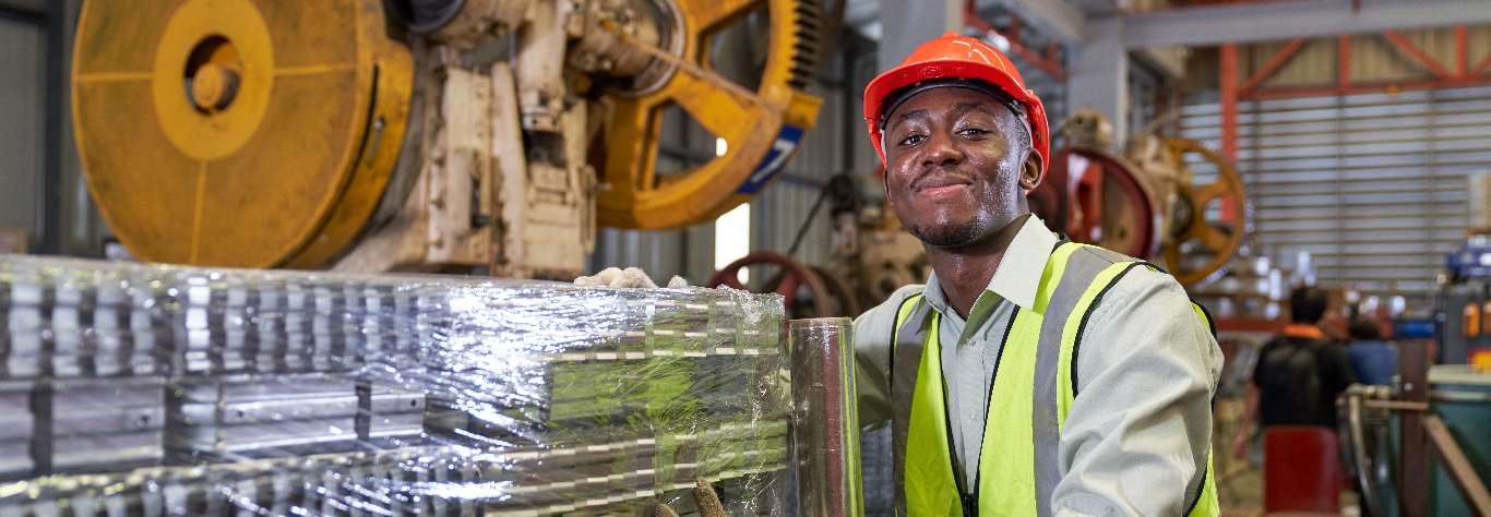 worker show completed packaging forming steel metal sheet in warehouse