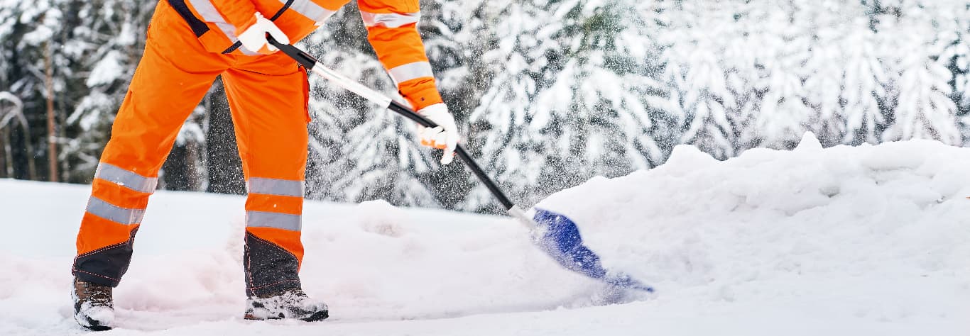 man in personalised hi viz working in the snow